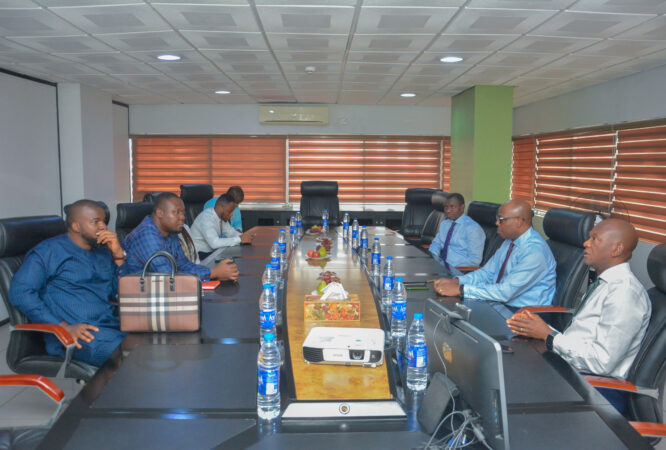 Management from both teams in discussion before the signing ceremony